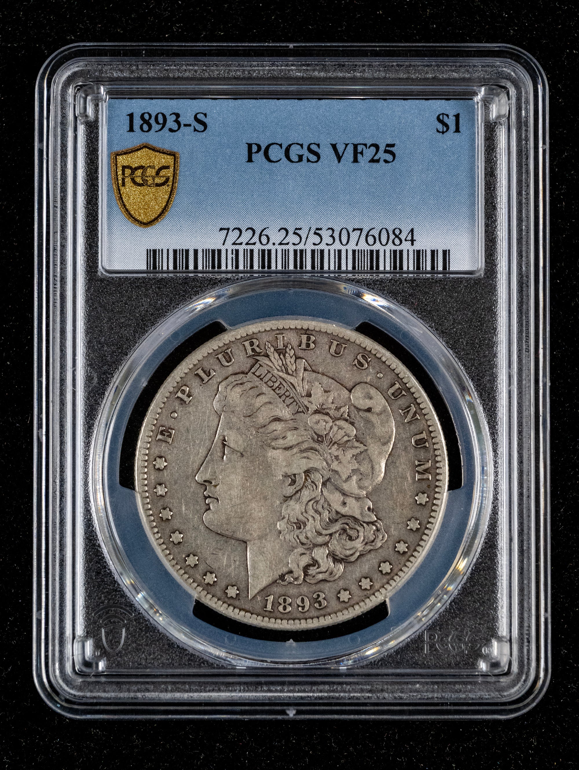 A 1893-S Morgan Silver Dollar coin encapsulated in a clear PCGS graded holder, showing a VF25 grade label at the top and the coin profile facing forward against a black background.