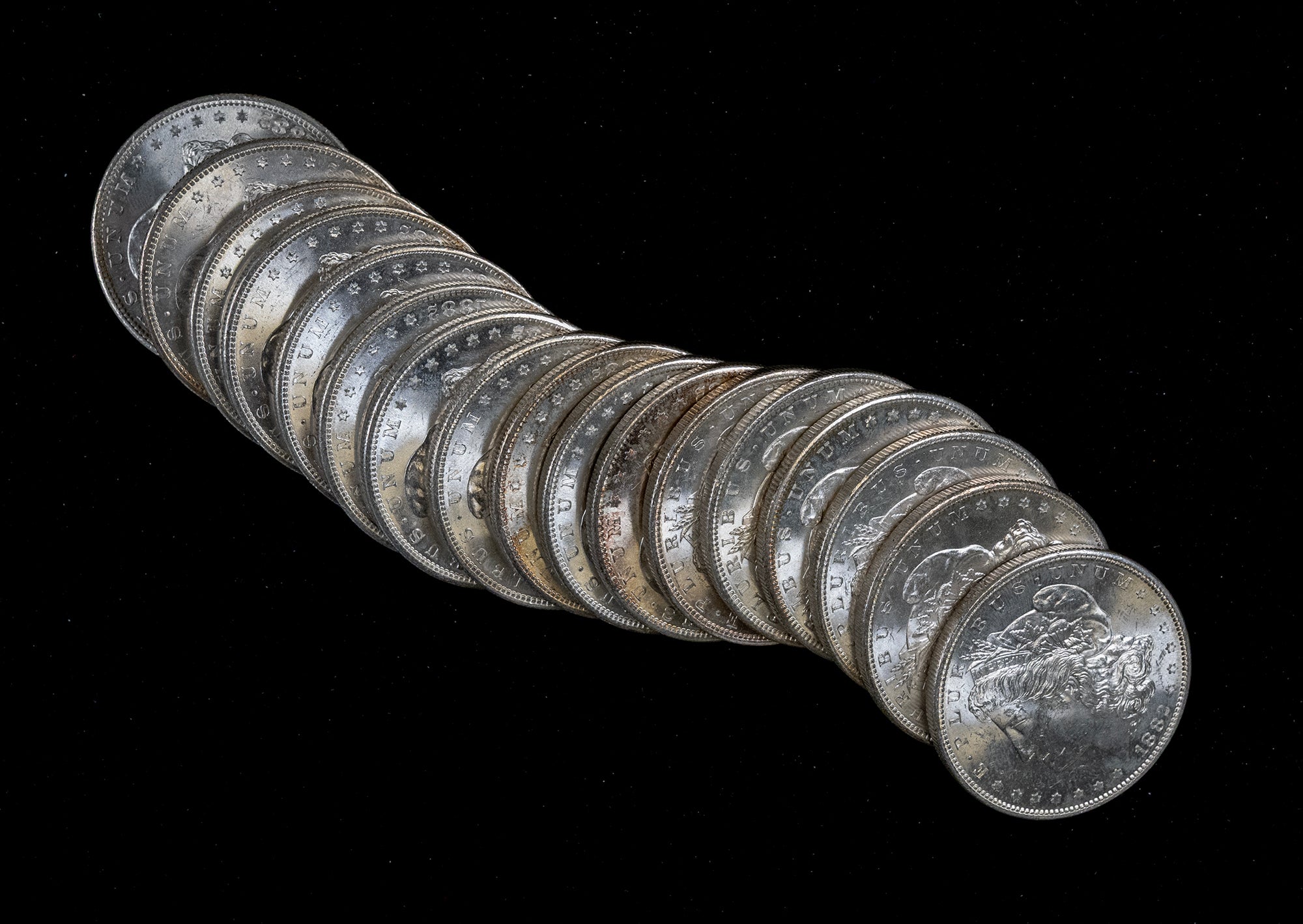 Stack of silver coins on a black background