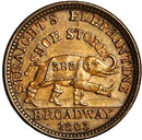 Vintage coin with an elephant design and text 'Straight's Elephant Store' on a white background